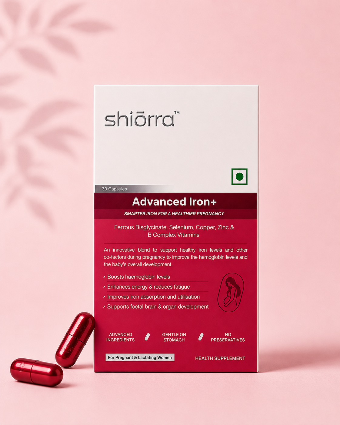 Two hands offering Shiōrra Advanced Iron+ capsules beside the pack and fresh ginger on a blue backdrop